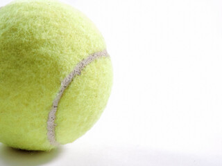 close up of tennis ball on white