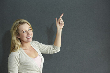 Woman pointing to the side