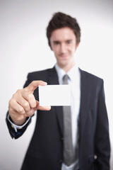 Businessman showing blank business card