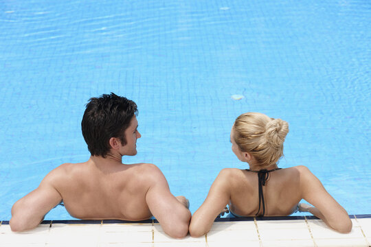 Man and woman relaxing in the pool