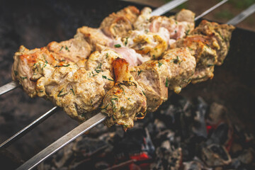 BBQ barbecuing skewers pork kebab, close up image.