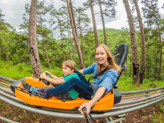 Mother and son on the alpine coaster