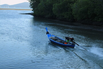 Long tail boat of fishermen on the sea