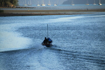 Long tail boat of fishermen on the sea
