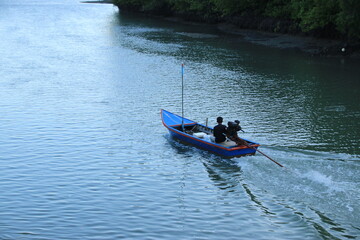 Long tail boat of fishermen on the sea