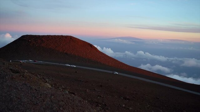 Haleakala crater with Mauna Kea and Mauna Loa in the background during blue hour