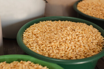 Raw corn in a basket, raw corn texture, Yellow grains as background- detail of organic golden corn