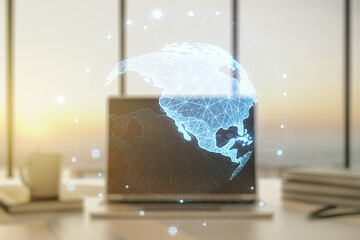 Double exposure of digital America map on laptop background, research and strategy concept