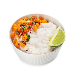 Bowl with boiled rice and pumpkin on white background