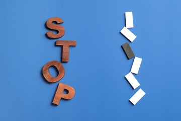 Text STOP with different blocks on color background. Stop racism