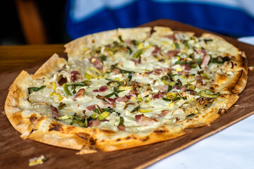 Tarte Flambee, ATraditional French Dish. Fresh Baked In A Wood-Fired Traditional Adobe Oven Flame Cake