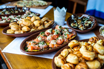 Party Brunch Fingerfood big Buffet table setting with Food Meat Vegetables