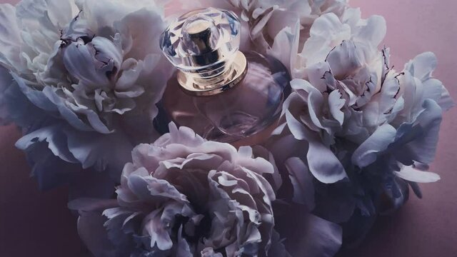 Purple perfume bottle with peony flowers, chic fragrance scent as luxury cosmetic, fashion and beauty product backgrounds