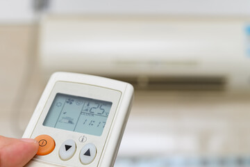 turning on an air conditioner via a remote control