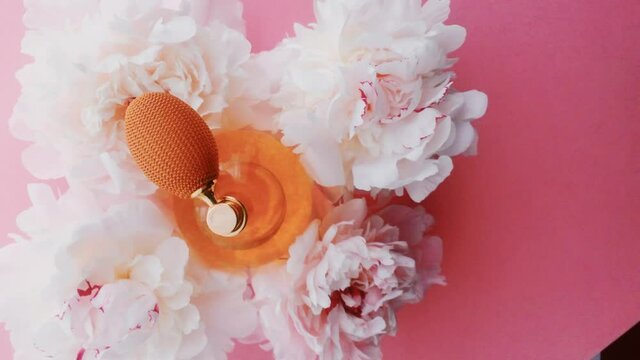Citrus perfume bottle with peony flowers, chic fragrance scent as luxury cosmetic, fashion and beauty product backgrounds