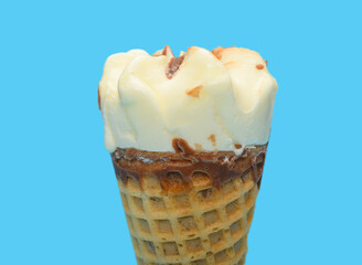 fresh vanilla flavor ice cream cone on blue background