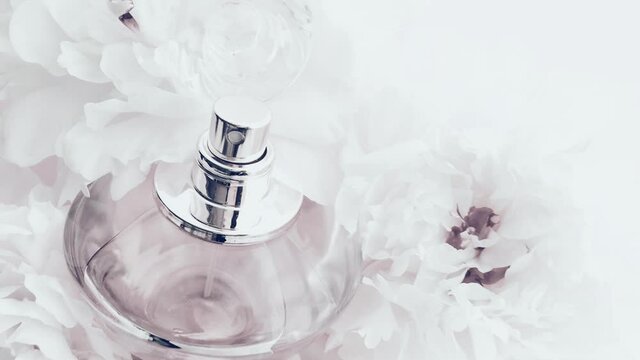 White perfume bottle with peony flowers, chic fragrance scent as luxury cosmetic, fashion and beauty product backgrounds
