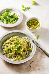 Zucchini pasta with peas and micro green sprouts. Healthy food.
