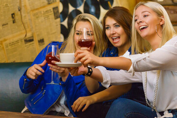 Happy girls in pub club having fun