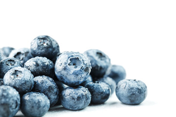Blueberries isolated on a white background. A scattering of ripe, juicy, delicious and healthy berries.
