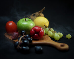 photo of wooden cutting board products and wooden trays, by adding properties to a variety of fresh fruit. Looks very attractive and elegant.