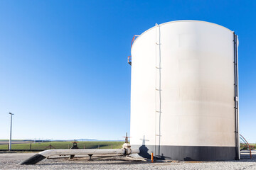 Oil storage tank farm in the petroleum refinery. Above ground storage tanks can be used to hold...