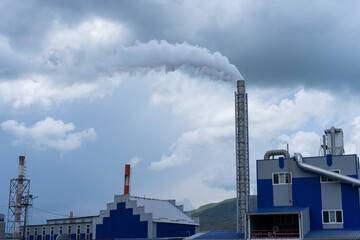 Factory polluting the atmosphere with smoke from production