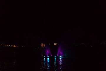 Illuminated fountain on the Dnieper river in Dnipro city, Ukraine