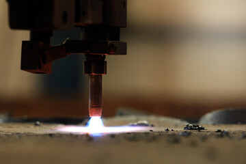View of the torch of the plasma cutter, arc and cutting. Plasma cutters use a number of methods to start the arc. In some units, the arc is created by putting the torch in contact with the work piece.