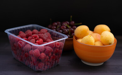 Ripe fruits on wooden background