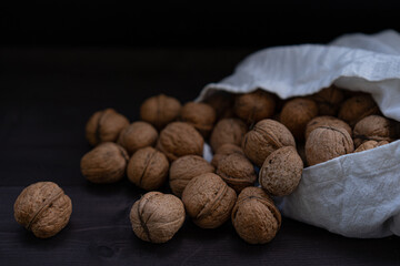 Ripe walnuts on a wooden background
