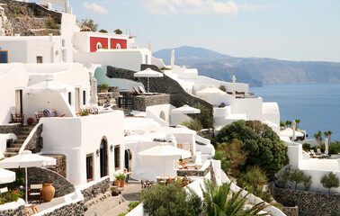 Beautiful village of Oia on the island of Santorini, Greece, white buildings, blue sky, terraced cliffs