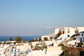 Beautiful village of Oia on the island of Santorini, Greece, white buildings, blue sky, terraced cliffs