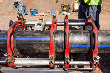 Polyethylene welder preparation for welding to pipes with polyethylene pipe welding machine.