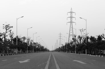 Asphalt road and high voltage power towers