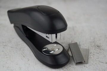 stapler and staples on white background