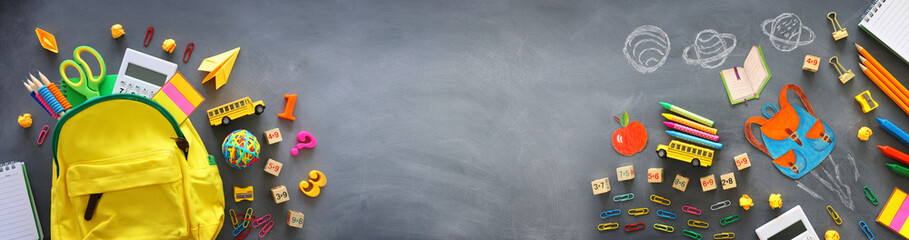 education. Back to school concept over blackboard background. top view, flat lay