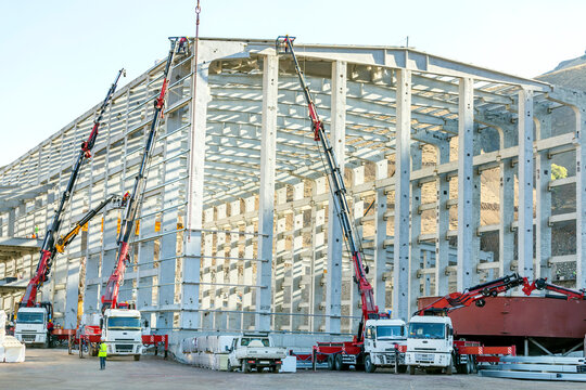 View of the hiab or hi-up cranes in the new construction plant. (Hiab) invented the world's first hydraulic truck mounted crane. (HIAB) is a Swedish manufacturer of loader cranes.