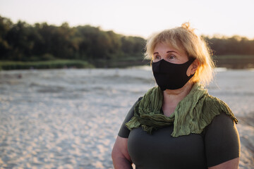 Portrait of senior woman wearing medical mask. coronavirus concept. respiratory protection
