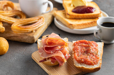 Spanish breakfast toasted bread with jamon (cured ham) and tomatoes for breakfast