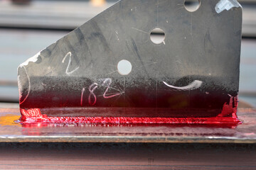 View of the dye penetrant inspection (DP) of the nondestructive testing to the fillet weld. The...