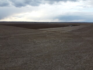 Agricultural machinery in the field, aerial view. Agricultural work.