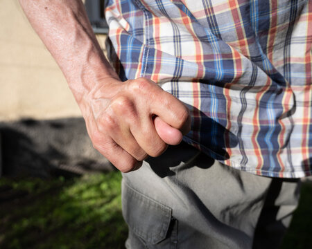 Man showing dulia sign outdoors