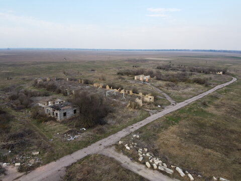 Destroyed livestock farm in the north of Ukraine, aerial view. Dilapidated industrial buildings.