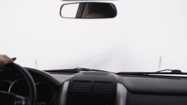 view from the car window on the storm road, drivers perspective of mountain road in Iceland