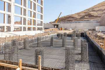 Installation of rebar, reinforcing steel bars for concrete in the construction site. Reinforcement cage fabrication and erection is one of the most important activities in construction projects.