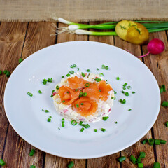 Salmon salad on a white plate