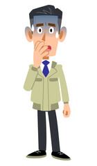 青ざめる作業着の男性
