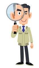 虫眼鏡を覗く作業着の男性
