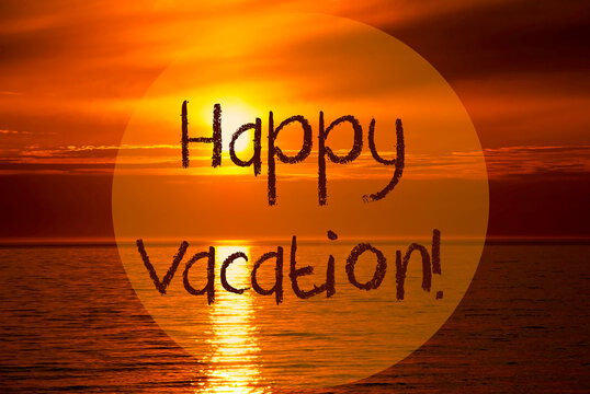 English Text Happy Vacation. Romantic Sunset Or Sunrise At Sea Or Ocean In The Background © Nelos